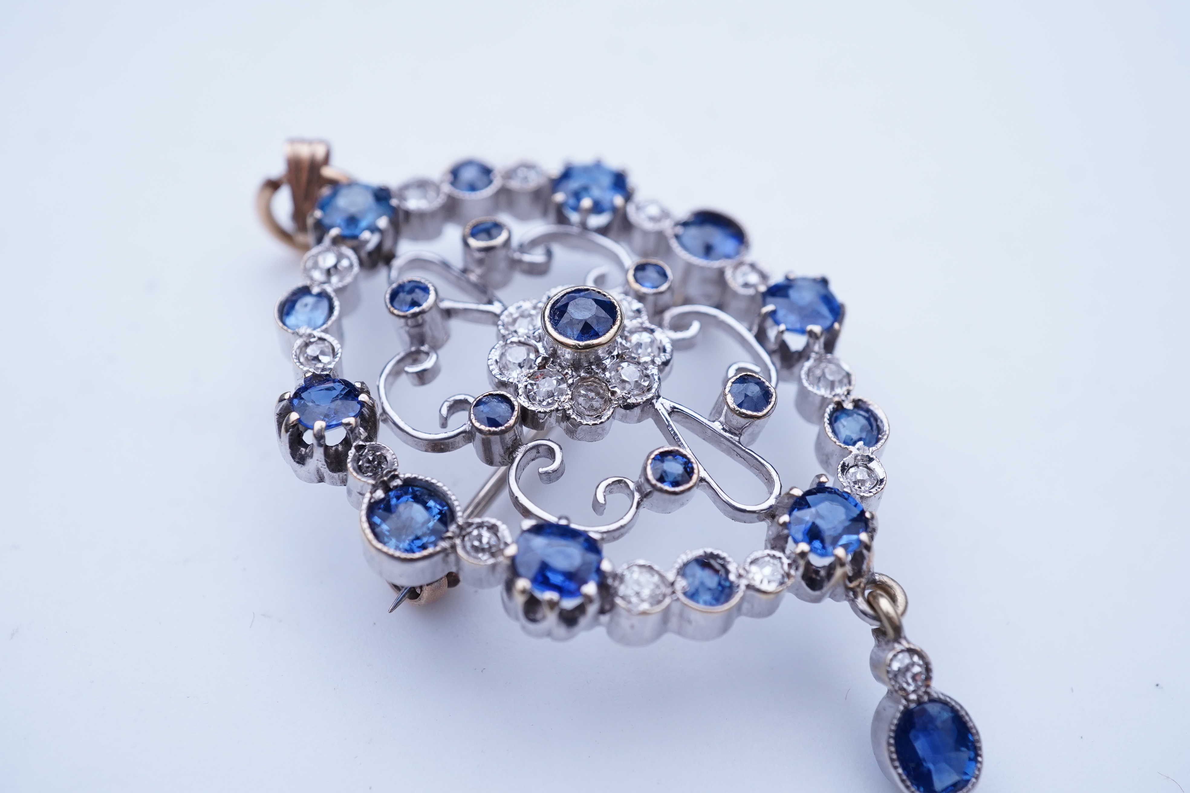 A sapphire and diamond brooch/pendant, mid 20th century